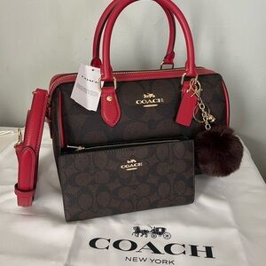 Coach Rowan Satchel Bag
In Maxi Signature Canvas And Wallet